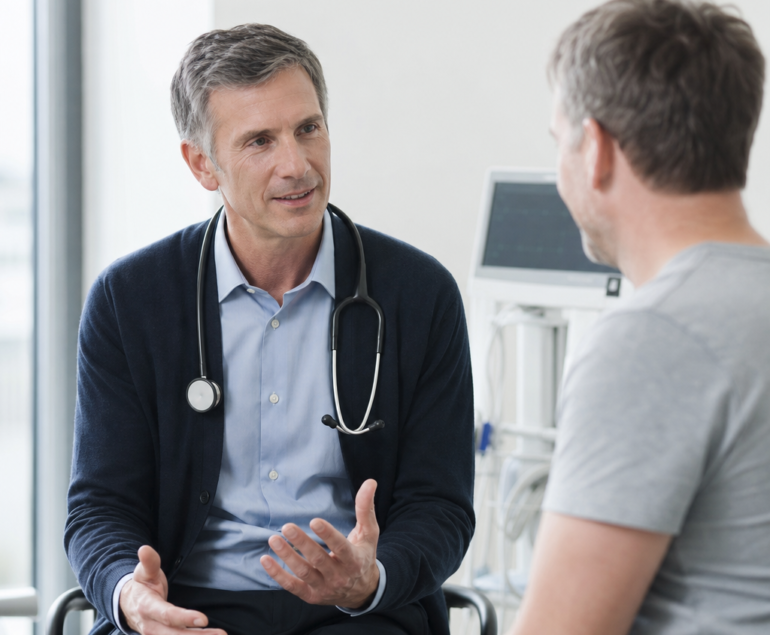 Cardiologist discussing heart symptoms with a patient during a consultation